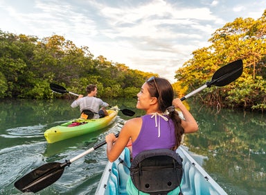 Two people kayaking on river in Torch Keys