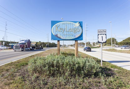 Key Largo welcome sign, flanked by highways