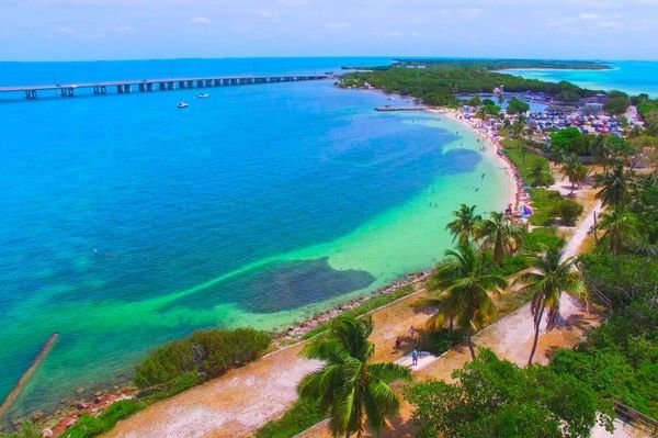 Aerial view of Florida Keys beachfront with Seven Mile Bridge in distance